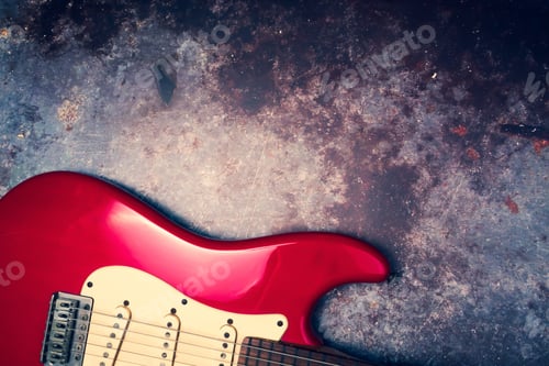 Preview: A red electric guitar on a grunge background.