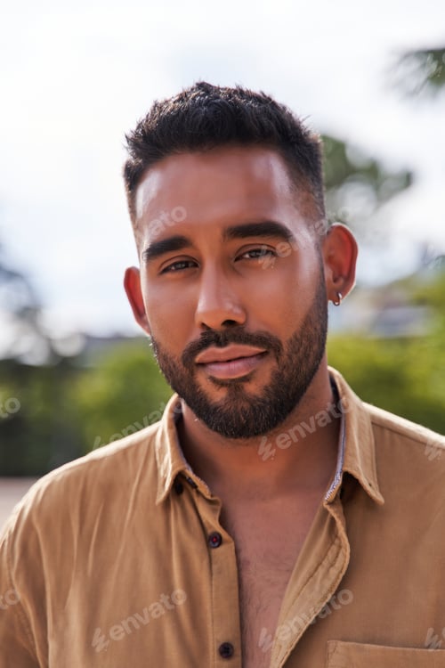Preview: portrait of a bearded hispanic man looking at the camera