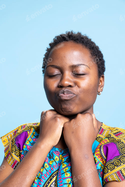 Preview: African American girl full of enthusiasm pulls silly poses for the camera
