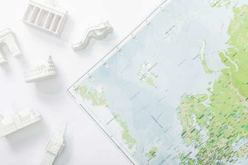 Preview: top view of map near figurines with attractions isolated on white