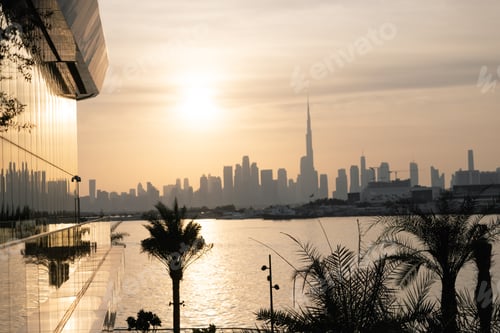 Preview: sunset city view from beach in evening time