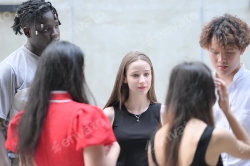 Preview: Group of young multiethnic friend having fun and laughing outdoors on beautiful summer day