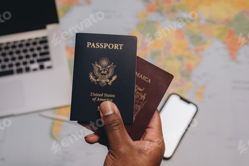 Preview: Travel and destination, African American man holding American passport and Jamaican passport