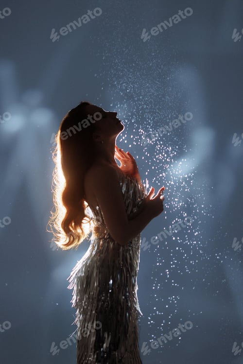 Preview: Glamorous Woman in Sparkling Light and Falling Glitter