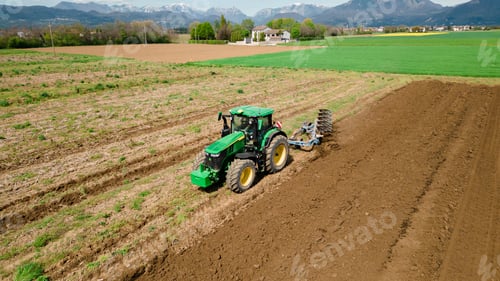 Preview: A picture of a rural farming community showcasing the use of farming machinery and equipment, such