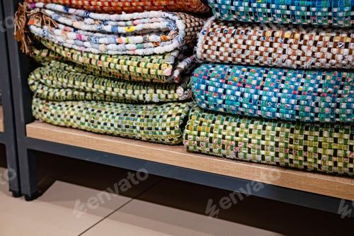 Preview: A woven rug made of old things. Eco-friendly development. Reuse of items. Handmade work.
