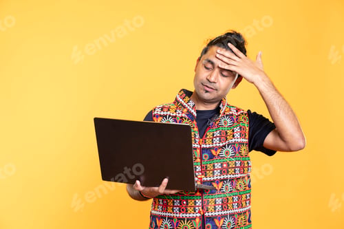 Preview: Overworked employee feeling headache while working on laptop
