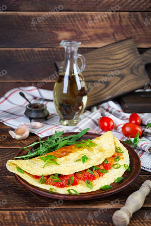 Preview: Omelette with fried onion and tomatoes. Fried eggs with herbs