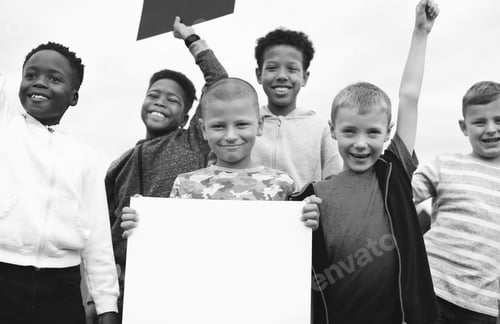 Preview: Group of young boys showing blank papers