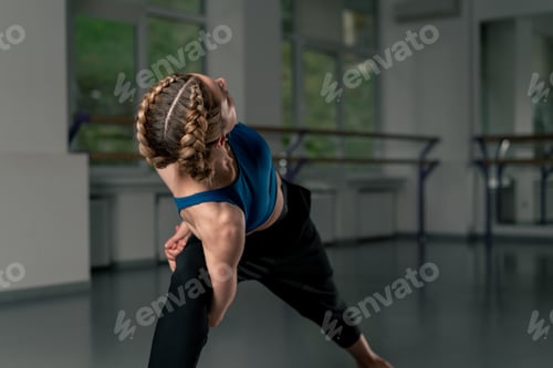 Preview: in the studio of spiritual development master class in yoga middle-aged girl in blue top and pants
