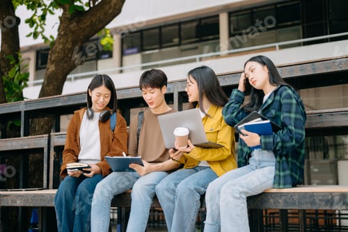 Preview: Asian Students are studying the campus park. Young people are spending time together.