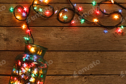 Preview: christmas lights border on wood background