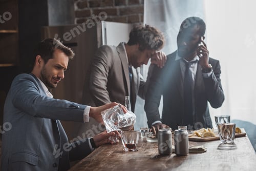 Preview: drunk multiethnic businessmen drinking whiskey together