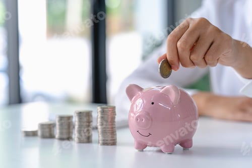 Preview: woman's hands saving money in piggy bank, saving money for the future for retirement savings from wo