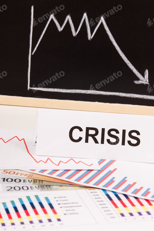 Preview: Inscription crisis, currencies euro and downward graphs representing financial crisis