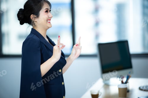 Preview: successful girl pointing thumb up; portrait of cheerful smiling woman pointing up approving