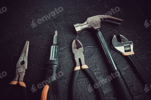 Preview: Many different tools for repair work on a black background
