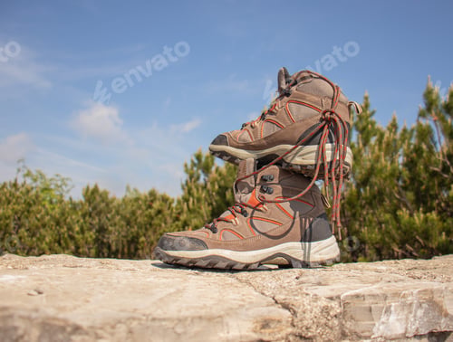 Preview: Pair of hiking boots stacked on a stone surface