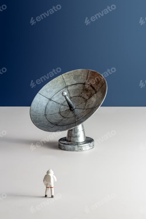 Preview: Minimalistic still life astronaut miniature looking at astronomical radio telescope vertical