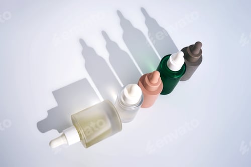 Preview: Cosmetic serum bottles casting long shadows on white background