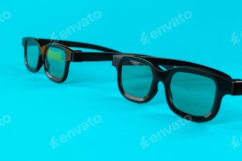 Preview: Pair 3D glasses on blue background. Flat lay.
