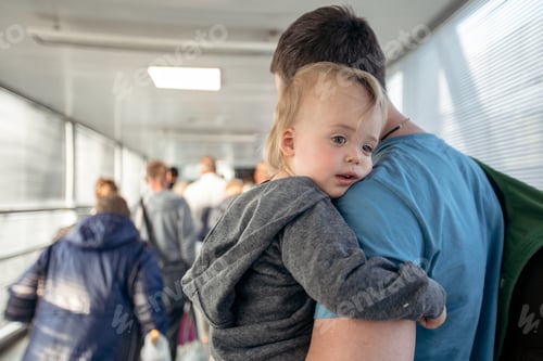 Preview: Man with child on travelator