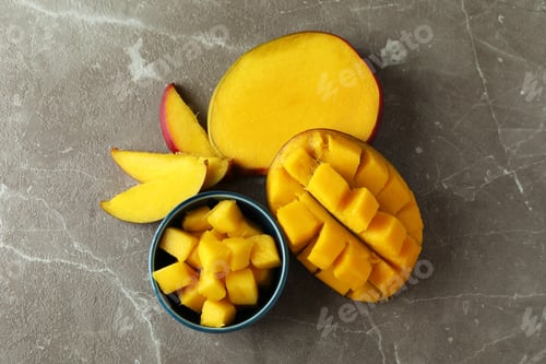 Preview: Tasty ripe mango fruit on gray textured background