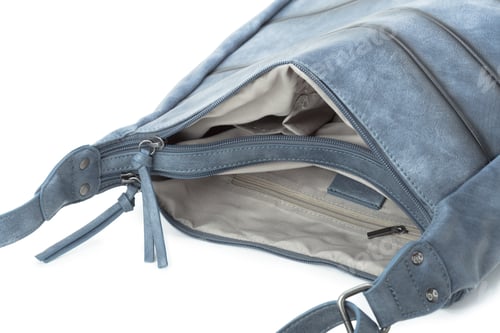 Preview: Capacious female purse handbag over a white background
