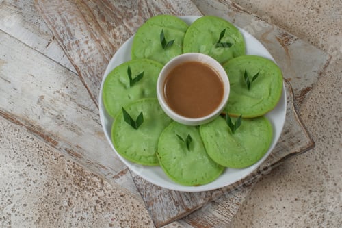 Preview: serabi or surabi - indonesian pancake,made from rice flour, coconut milk and served with brown sugar