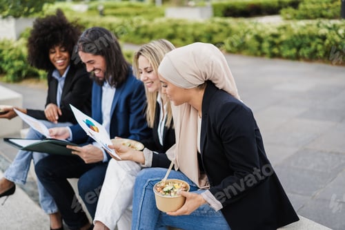 Preview: Multiethnic business people doing lunch break outdoor from office building