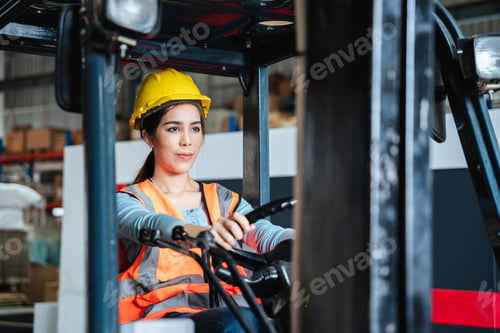 Preview: Portrait of a female worker with a forklift in the warehouse., Industrial and industrial concept.