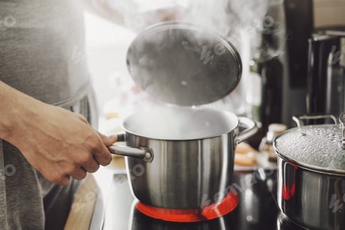 Preview: Man cooking fresh food at home