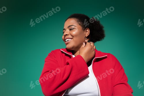 Preview: Stylish plus size african american woman embraces autumn fashion in studio setting