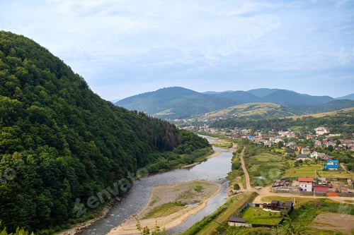 Preview: Carpathian Mountains Range, Ukraine. Carpathian view of a mountain river and village