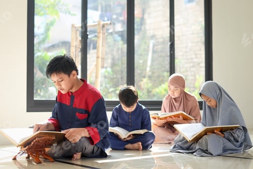 Preview: Group of Muslim Asian kids reading Quran together with friends at the mosque