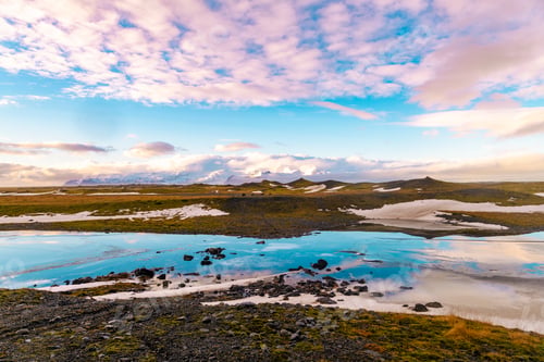 Preview: Serene landscape with reflective water and colorful sunset sky.