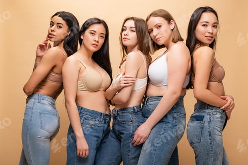 Preview: five beautiful multicultural girls posing at camera isolated on beige, body positivity concept