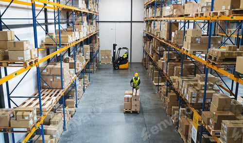 Preview: Men workers with forklift and pallet truck working indoors in warehouse, coronavirus concept.