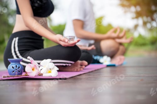Preview: Yoga fitness lifestyle healthy woman relaxation doing a meditation. Yoga meditating outdoor