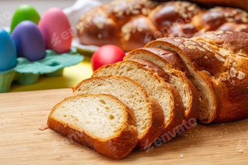 Preview: Easter tsoureki braid slices, greek easter sweet bread, on wood