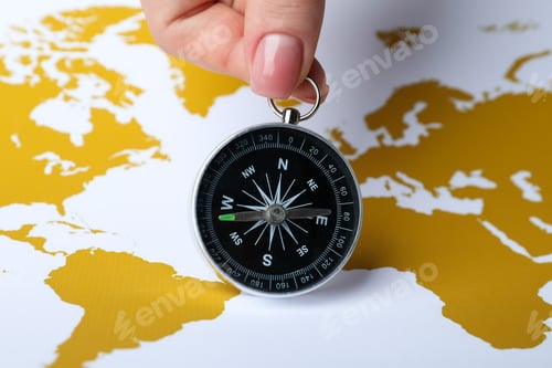 Preview: Compass on the background of the world map.