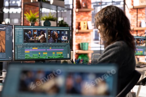 Preview: Female filmmaker working on media post production from agency office
