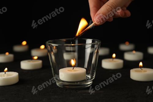 Preview: Lighting the fire of the candle of mourning.
