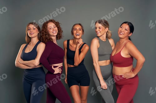 Preview: Group of five young women in sports clothes in studio shot