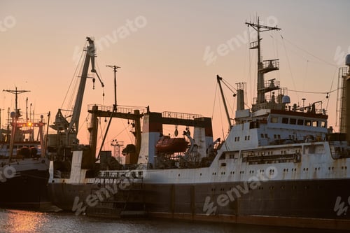 Preview: Ships in sea port on sunset background
