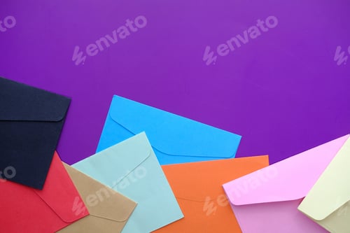 Preview: Vibrantly Colorful Envelopes on a Purple Background Perfect for Creative Projects and More