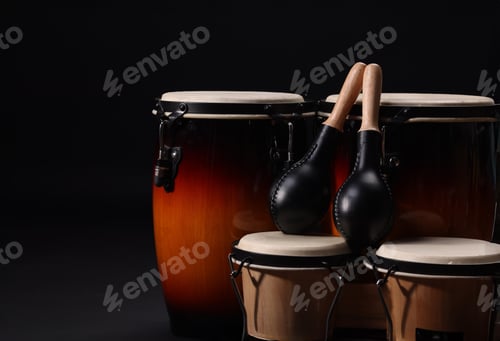 Preview: Different drums on a black background, percussion musical instruments.