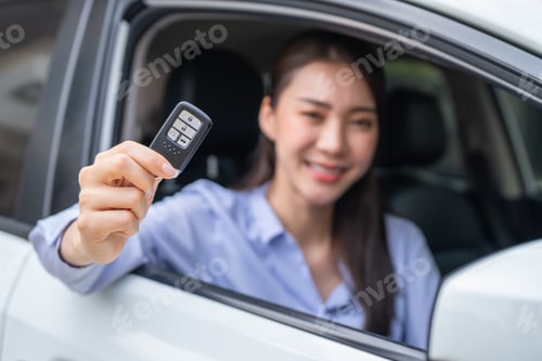 Preview: Portrait of Asian beautiful woman driver sitting in car before driving.