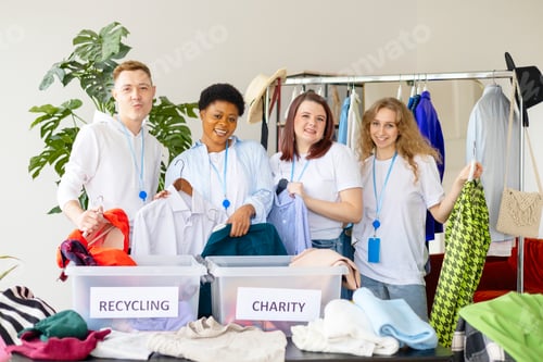 Preview: young people are engaged in charity and volunteering, selecting clothes for recycling and charity