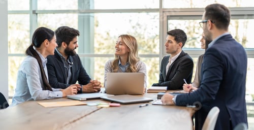 Preview: Woman presenting her analysis to her diversity business team during meeting at office room.